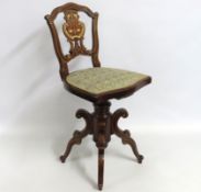 An early 19thC. Regency period inlaid mahogany revolving music chair, 825mm high to back. Ivory subm