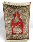A silk pile prayer carpet, 1150mm x 705mm