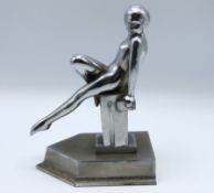 A Japanese art deco style chrome book end of naked
