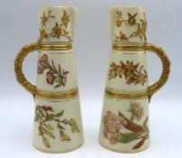 A pair of Royal Worcester jugs, decorated with gil