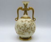 A Royal Worcester porcelain vase with dolphin hand