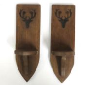 A pair of oak Gothic style corbels with relief sta