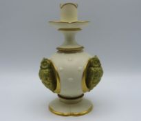 A Royal Worcester porcelain candle holder featurin