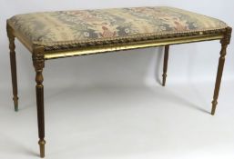 A Regency style window seat with gilded legs, 910m