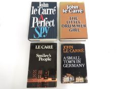 Four John Le Carre novels including two hard backs