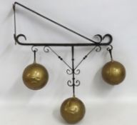 A traditional pawn brokers shop sign with iron bra