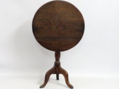A Georgian oak tilt top pedestal table, 675mm high