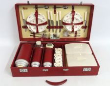 A mid 20thC. retro picnic set, handle detached, la