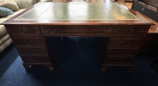 A pedestal desk with nine drawers, some marks & fa