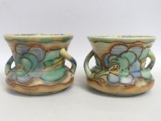 A pair of Carlton Ware tube lined art nouveau pots