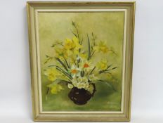 Angela Hutt, a framed oil still life of daffodils,