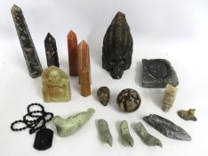 A selection of various minerals & rocks carved into various shapes including a carved & polished sku