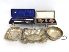 A cased silver plated salt set, a plated fish serving set & three silver plated bread baskets & bowl