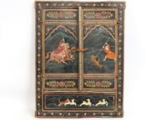 A hand painted Indian window shutter depicting hun