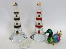 Two crystal lighthouses, a Swarovski crystal swan