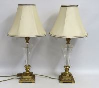 A pair of brass based lamps with shade, 710mm tall
