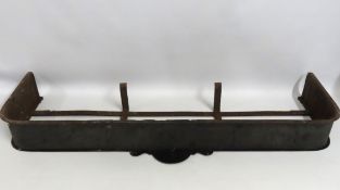 A Georgian wrought iron fender, internal measureme