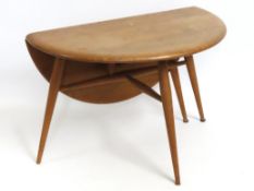 A small Ercol elm one side drop leaf occasional ta
