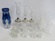 Three graduated silver based posy vases, some faul