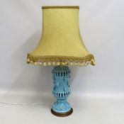 A decorative pottery lamp with shade, 820mm tall
