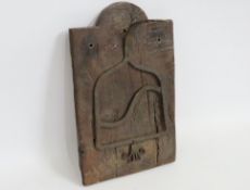 A Elizabethan oak wall mounted panel with forged i