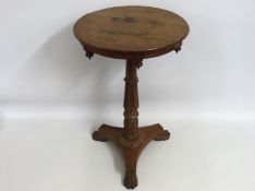 A 19thC. Regency style oak pedestal table with cla