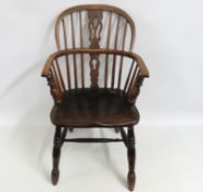 A 19thC. elm Windsor chair, some faults, 905mm hig