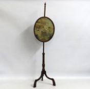 A 19thC. mahogany pole screen with finely embroide