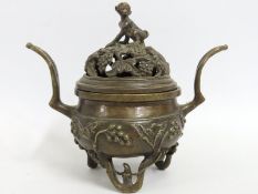 A Chinese archaic style bronze censer with monkey