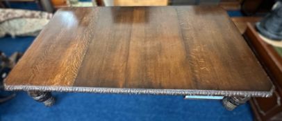 A large extending Victorian oak dining table, 2390