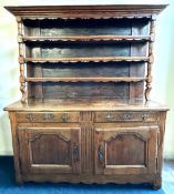 An 18thC. continental oak dresser, 1890mm high x 1