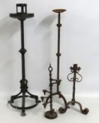A substantial ecclesiastical, Gothic wrought iron candle holder twinned with three others, tallest 9