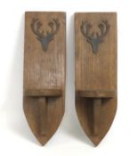 A pair of oak Gothic style corbels with relief sta