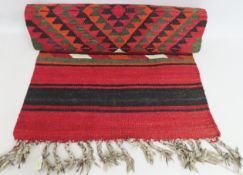 An Afghan style woollen carpet runner, 3520mm long