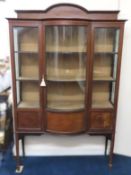 An Edwardian breakfront display cabinet, top friez