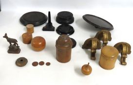 A selection of antique treen pots, three giltwood