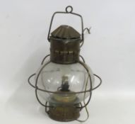 An antique nautical lamp, later converted to elect