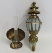 A brass coaching style lamp twinned with a smaller
