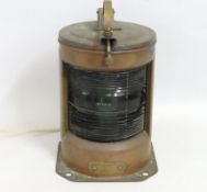 An early 20thC. copper stern nautical lamp with el