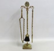 A brass companion set with the 