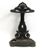 A 19thC. cast iron umbrella stand, tray damaged to