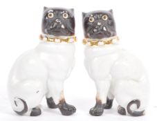 PAIR OF 19TH CENTURY STAFFORDSHIRE PU DOG FIGURINES
