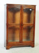JACOBEAN REVIVAL CARVED OAK BOOKCASE CABINET