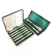 TWO GEORGE V CASED SETS OF HALLMARKED SILVER HANDLED ITEMS