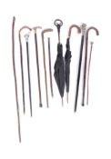 COLLECTION OF WALKIG STICKS & UMBRELLAS