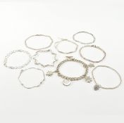 COLLECTION OF ASSORTED SILVER CHAIN BRACELETS