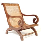 19TH CENTURY VICTORIAN COLONIAL TEAK AND CANE PLANTATION CHAIR