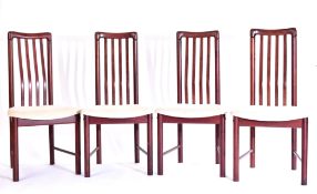 MATCHING SET OF FOUR DANISH DESIGNED TEAK DINING CHAIRS