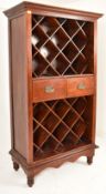 20TH CENTURY HARDWOOD WINE CABINET ON FEET