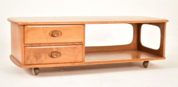 ERCOL - MINERVA - 1970S ELM COFFEE TABLE RAISED ON CASTORS